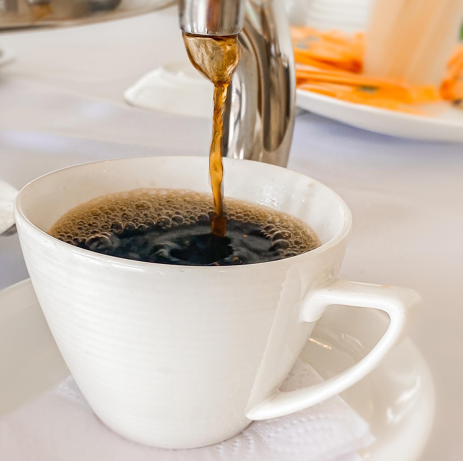 Hotel Royal Elim International Cali Eksteriør billede Coffee being poured