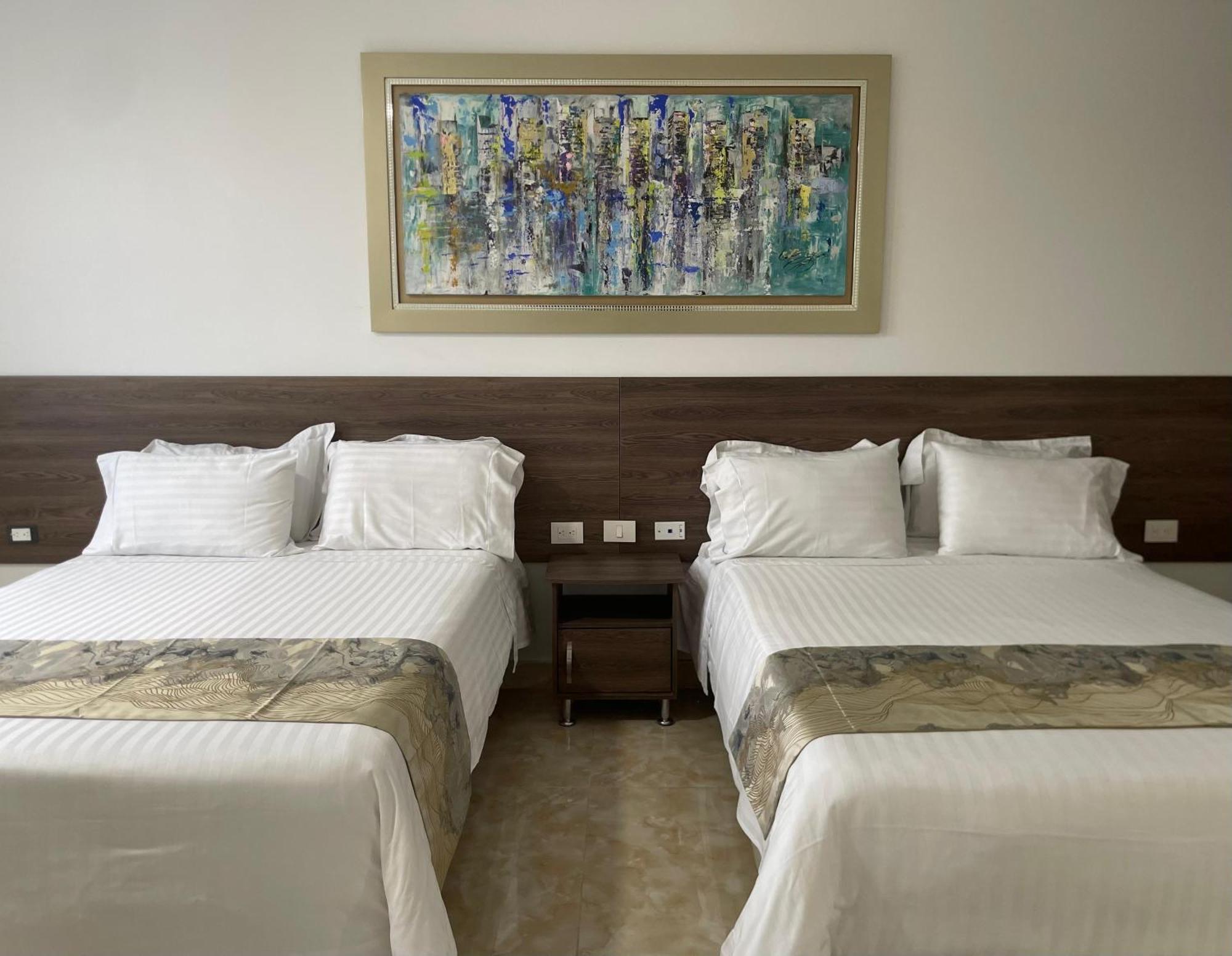 Hotel Royal Elim International Cali Eksteriør billede A room at the hotel